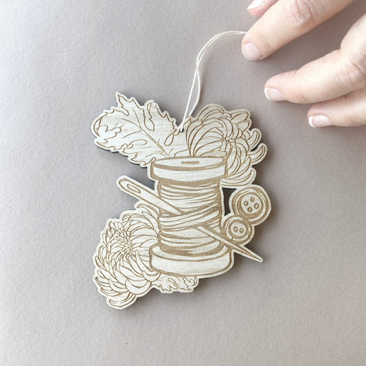 Thread & Bloom – Tattoo-Inspired Spool Ornament